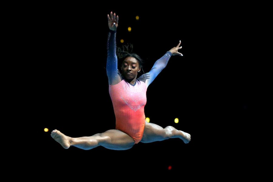 LOS ANGELES, CALIFORNIA - SEPTEMBER 25: Simone Biles performs during the Gold Over America Tour at Staples Center on September 25, 2021 in Los Angeles, California. (Photo by Katharine Lotze/Getty Images)